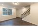 Open basement area with hardwood flooring, recessed lighting, and stairs at 326 Olmstead Way # 41, Alpharetta, GA 30022