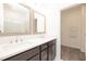 Elegant bathroom with dual sinks, quartz counters, and a luxurious glass shower at 326 Olmstead Way # 41, Alpharetta, GA 30022