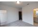 Open bedroom with closet door, carpeted floor, and attached bath at 326 Olmstead Way # 41, Alpharetta, GA 30022