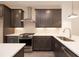 Modern kitchen featuring stainless steel appliances, undermount sink, and dark wood cabinets at 326 Olmstead Way # 41, Alpharetta, GA 30022