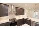 Well-lit kitchen featuring stainless steel appliances, modern fixtures, and white backsplash tiles at 326 Olmstead Way # 41, Alpharetta, GA 30022