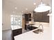 Kitchen area featuring a center island, stainless steel appliances, and a large sink at 326 Olmstead Way # 41, Alpharetta, GA 30022