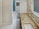Well-appointed bathroom featuring updated granite countertops, and tile at 720 Smithstone Se Rd, Marietta, GA 30067