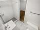 This bathroom features a white tiled stand up shower with a vanity and a toilet at 720 Smithstone Se Rd, Marietta, GA 30067