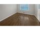Bedroom with new dark floors, natural light, and ample closet space at 720 Smithstone Se Rd, Marietta, GA 30067