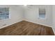 Inviting bedroom with new dark floors, natural light, and a ceiling fan at 720 Smithstone Se Rd, Marietta, GA 30067