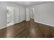 Spacious bedroom featuring new dark floors with adjoining bathroom at 720 Smithstone Se Rd, Marietta, GA 30067