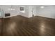 Open-concept living space with dark wood flooring and a classic fireplace at 720 Smithstone Se Rd, Marietta, GA 30067