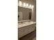 Bathroom with double sink vanity, granite countertop and modern lighting at 3405 Ripple Loop # 127, South Fulton, GA 30349