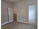 Spacious bedroom with neutral walls, plush carpet flooring, and access to walk-in closet at 3405 Ripple Loop # 127, South Fulton, GA 30349