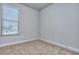 Sunlit bedroom with neutral carpeting and a large window, perfect for creating a serene and relaxing atmosphere at 3405 Ripple Loop # 127, South Fulton, GA 30349