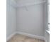 Walk-in closet with shelving ready to keep your wardrobe organized, complemented by the light from the adjacent window at 3405 Ripple Loop # 127, South Fulton, GA 30349