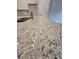 Close up view of the kitchen's granite countertop with a stainless steel sink and faucet at 3405 Ripple Loop # 127, South Fulton, GA 30349
