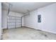 Spacious two car garage with concrete floor and modern door at 3405 Ripple Loop # 127, South Fulton, GA 30349
