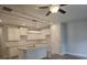 Spacious kitchen featuring stainless appliances, white cabinets, and open layout with a modern light fixture at 3405 Ripple Loop # 127, South Fulton, GA 30349