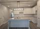 Modern kitchen featuring white cabinets, subway tile backsplash, granite countertops and island with sink at 3405 Ripple Loop # 127, South Fulton, GA 30349