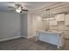 Open-concept living space with a kitchen island, modern lighting, and wood-look flooring at 3405 Ripple Loop # 127, South Fulton, GA 30349