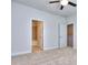 Main bedroom leading to an en suite bathroom with plush carpeting and ceiling fan at 3405 Ripple Loop # 127, South Fulton, GA 30349