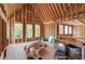 Unfinished bonus room with tall ceilings and wooden supports, with great natural light from strategically placed windows at 2675 Drayton Hall Dr, Buford, GA 30519