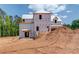 A home under construction, showcasing its architectural potential amidst a construction site at 2675 Drayton Hall Dr, Buford, GA 30519