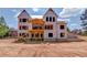 A home under construction, presenting its grand facade and architectural design amidst a construction site at 2675 Drayton Hall Dr, Buford, GA 30519