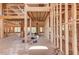 The unfinished interior shows a large open-concept layout with exposed wood framing and high ceilings at 2675 Drayton Hall Dr, Buford, GA 30519