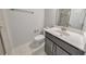 Cozy bathroom featuring a single sink vanity, toilet, and a shower with glass door at 550 Whitlox Nw Rd, Atlanta, GA 30318