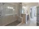 Modern bathroom with a large glass shower, tile surround, and vanity with sink, providing a spa-like experience at 550 Whitlox Nw Rd, Atlanta, GA 30318
