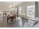 Bright dining area with large windows, hardwood floors, and comfortable seating at 550 Whitlox Nw Rd, Atlanta, GA 30318