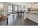 Open concept living space with large dining table and kitchen island at 550 Whitlox Nw Rd, Atlanta, GA 30318