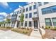 Modern townhome exterior with brick facade, dark trim, and inviting entryways at 550 Whitlox Nw Rd, Atlanta, GA 30318
