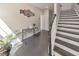 Welcoming foyer with dark wood floors, staircase, and elegant decor at 550 Whitlox Nw Rd, Atlanta, GA 30318