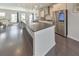 Open-concept kitchen and dining area featuring stainless steel appliances and a large island at 550 Whitlox Nw Rd, Atlanta, GA 30318