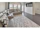 Living room featuring a modern couch, a rug, hardwood floors, and a mounted TV at 550 Whitlox Nw Rd, Atlanta, GA 30318