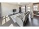 Comfortable living room featuring a gray reclining sofa, TV, and dark wood floors at 550 Whitlox Nw Rd, Atlanta, GA 30318