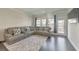 Cozy living room featuring a modern couch, a rug, and bright windows at 550 Whitlox Nw Rd, Atlanta, GA 30318