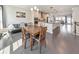 Open-concept living and dining area featuring wood floors and modern lighting at 550 Whitlox Nw Rd, Atlanta, GA 30318