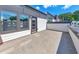 Spacious outdoor patio area, great for relaxing and entertaining with views of trees and blue skies at 550 Whitlox Nw Rd, Atlanta, GA 30318
