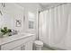 Bright bathroom features a white vanity, neutral walls, and shower with curtain at 330 Wagon Way, Alpharetta, GA 30009
