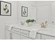 Bright bathroom featuring double sinks, a large mirror, and contemporary fixtures at 330 Wagon Way, Alpharetta, GA 30009