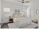 Comfortable bedroom with a modern ceiling fan, neutral decor, and natural light at 330 Wagon Way, Alpharetta, GA 30009