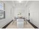 Bright formal dining room featuring stylish seating, a large window, and elegant finishes perfect for elegant gatherings at 330 Wagon Way, Alpharetta, GA 30009