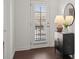 Entryway with a view to the outside, featuring a stylish cabinet, lamp, and artwork at 330 Wagon Way, Alpharetta, GA 30009