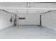Spacious and well-lit two-car garage with epoxy flooring and ample storage space at 330 Wagon Way, Alpharetta, GA 30009