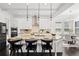 This large kitchen with island barstool seating flows into the adjacent dining area, offering a seamless entertaining space at 330 Wagon Way, Alpharetta, GA 30009