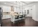 Bright kitchen features a large island, pendant lighting, and stainless steel appliances, ideal for modern living at 330 Wagon Way, Alpharetta, GA 30009