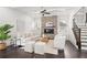 Inviting living room features a stone fireplace, ample seating, and elegant finishes perfect for relaxation and entertaining at 330 Wagon Way, Alpharetta, GA 30009