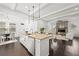 Open living space with modern kitchen, dining area and living room provides a comfortable and inviting atmosphere at 330 Wagon Way, Alpharetta, GA 30009