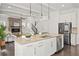 Open living space with modern kitchen, dining area and living room provides a comfortable and inviting atmosphere at 330 Wagon Way, Alpharetta, GA 30009
