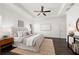 Primary bedroom with dark wood floors, neutral walls, ceiling fan and tray ceilings at 330 Wagon Way, Alpharetta, GA 30009